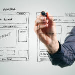 designer drawing website development wireframe